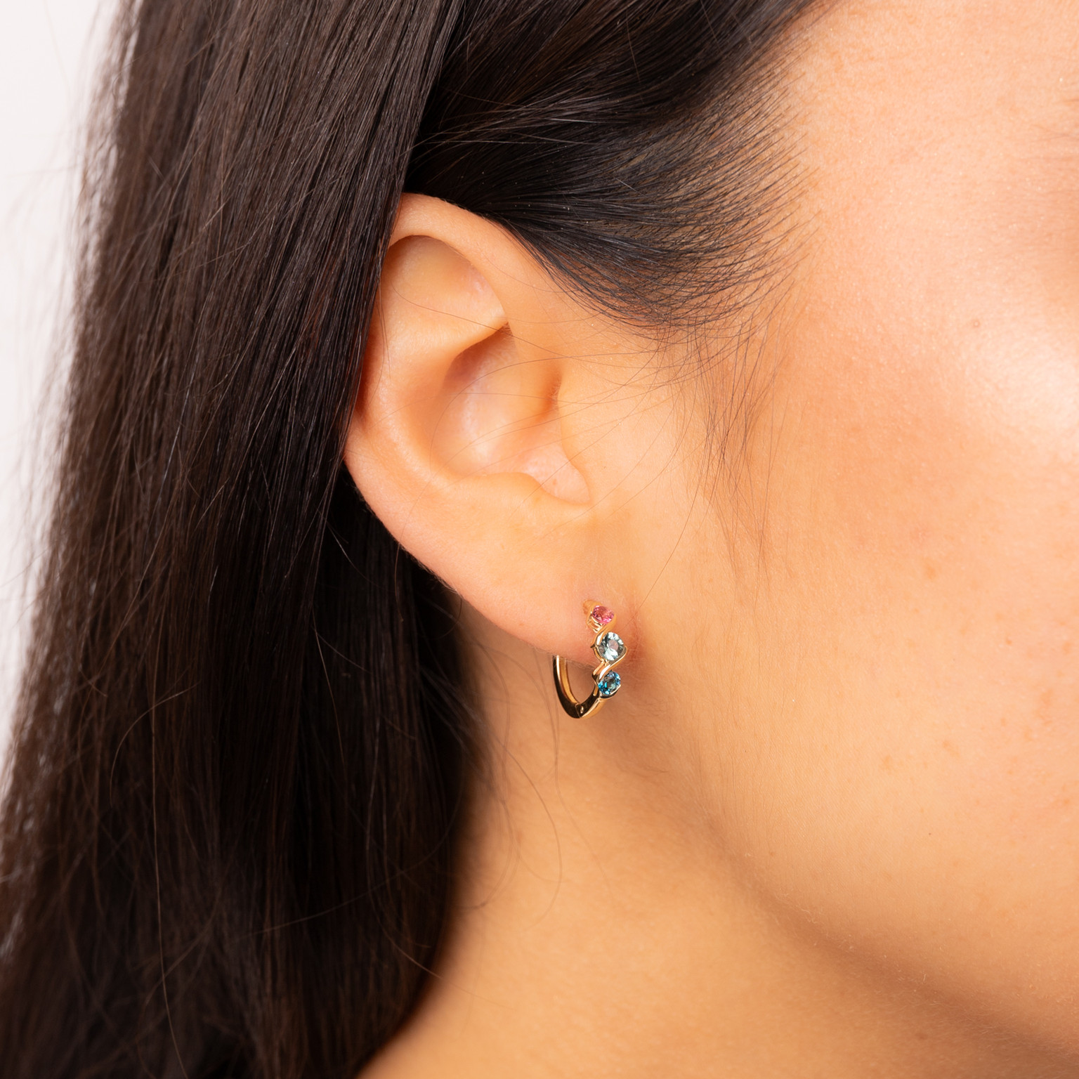 9ct yellow gold hoop earrings with green sapphire, pink tourmaline and london blue topaz, worn